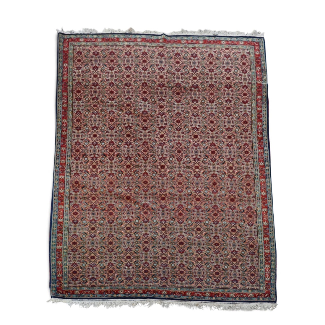 Antique Persian Ferahan Prayer Rug: Antique Persian Ferahan prayer rug, first quarter 20th century, having an allover Herati fish pattern rendered predominantly in reds, within a bluish and red single-guarded border. [Overall: 4 ft. 8 i