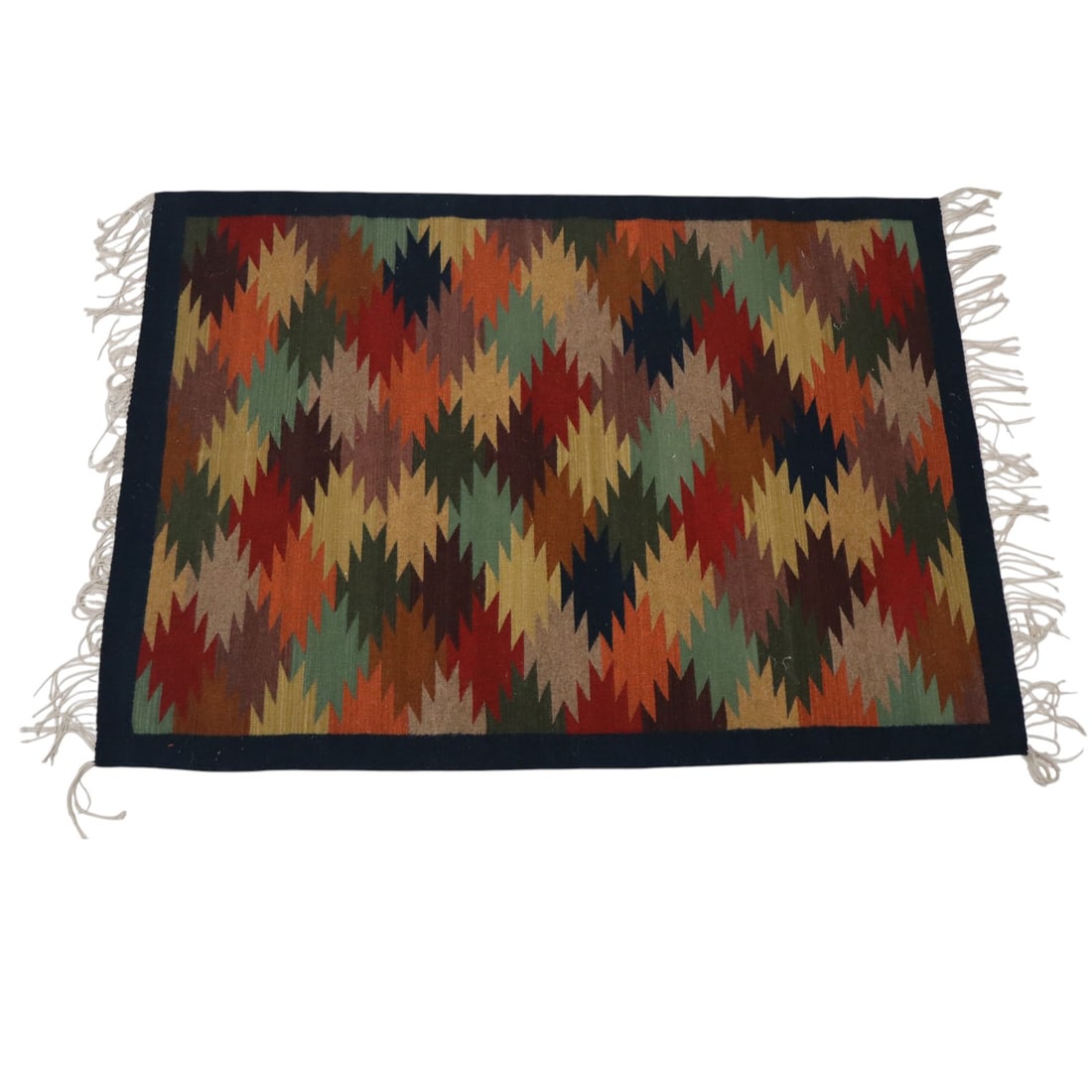 Handwoven Mexican Wool Jute Flatweave Area Rug: Handwoven Mexican wool jute flatweave area rug having a polychrome stepped geometric pattern with navy blue border. From a private collection in New Hope, Pennsylvania. [74" L x 51" W]. Wear and resid