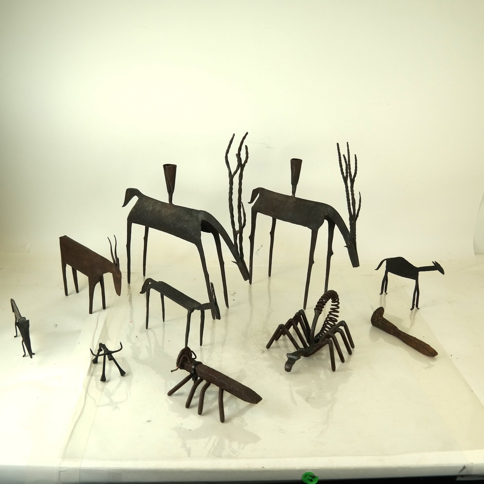 Eleven Assorted Metal Art Items: Lot includes figures, arts & crafts and animals. [Tallest: 16" H]. In good condition.