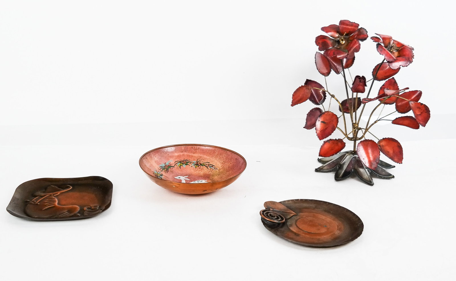 Sagitta Enamel & Metal Decorated Bowl & 3 Others: Decorative metal group, 20th century, comprising an enamel decorated copper fawn bowl signed to base "Sagitta Holland," two metal decorative plates, and a metal flower-form wire decoration. [Floral ar
