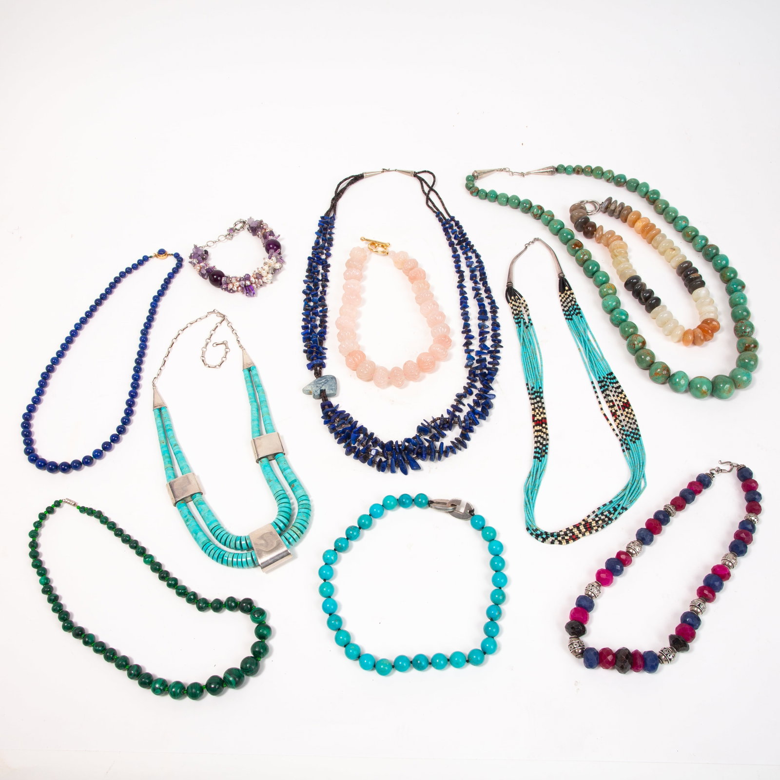 Tiffany, Gumps Group of Stone Jewelry, 11: Group of assorted stone jewelry, comprising four turquoise necklaces, one fluted rose quartz bead necklace, one Paloma Picasso for Tiffany & Co. agate necklace, one faceted ruby and sapphire bead neck