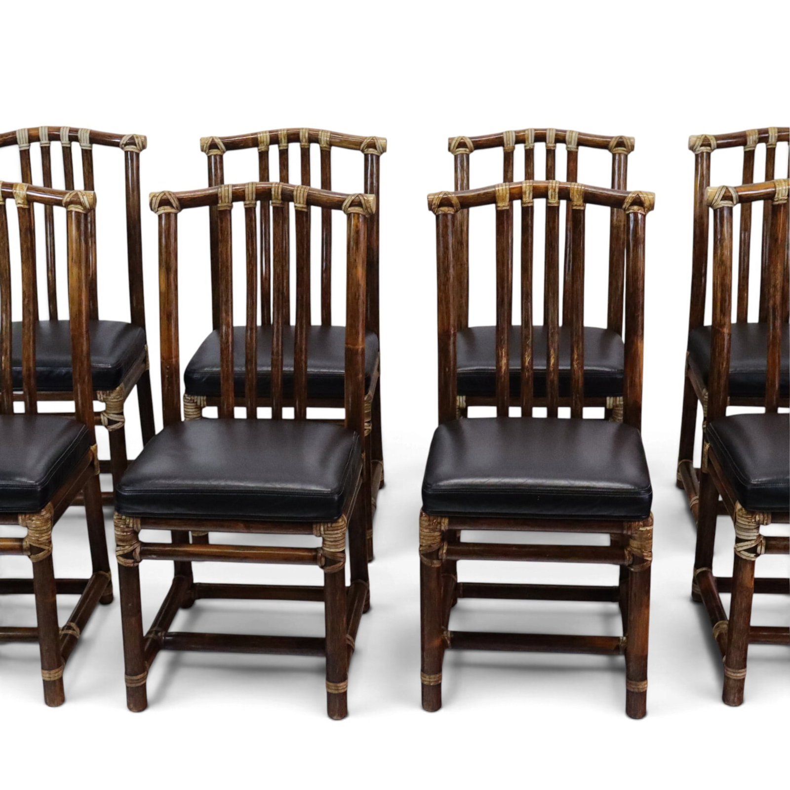 McGuire Furniture Bamboo Side Chairs, 8: Eight bamboo side chairs by McGuire furniture, made in Philippines, later 20th century, with leather seats and leather joinery detail, each marked to underseat. [37" H x 17" W x 20" D; seat height: 19