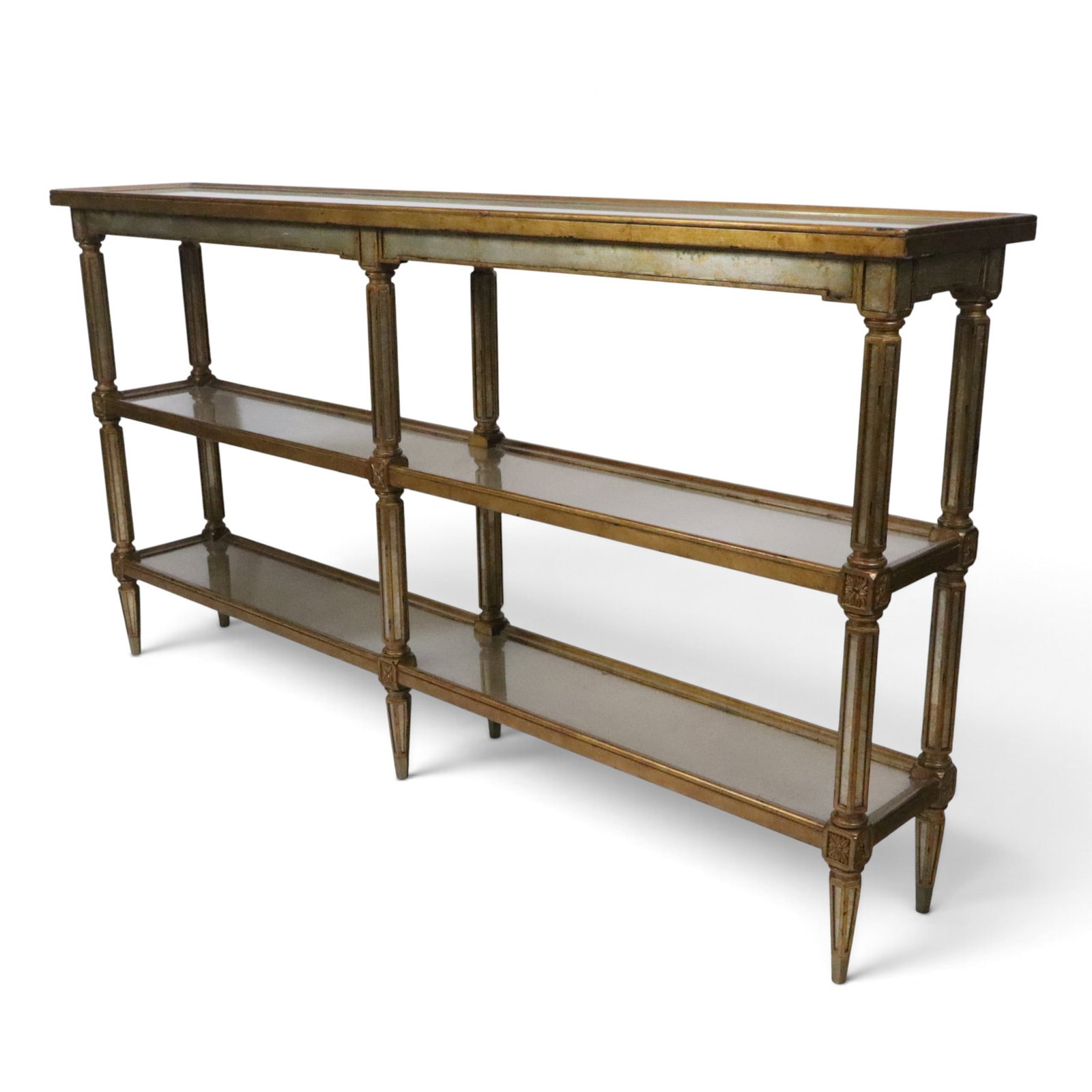 Theodore Alexander Louis XVI Console: Theodore Alexander three tier console, 20th century, with gilt and inset glass designs, with Theodore Alexander label to underside or uppermost tier. [36" H x 66" W x 10.5" D]. Condition is good, some