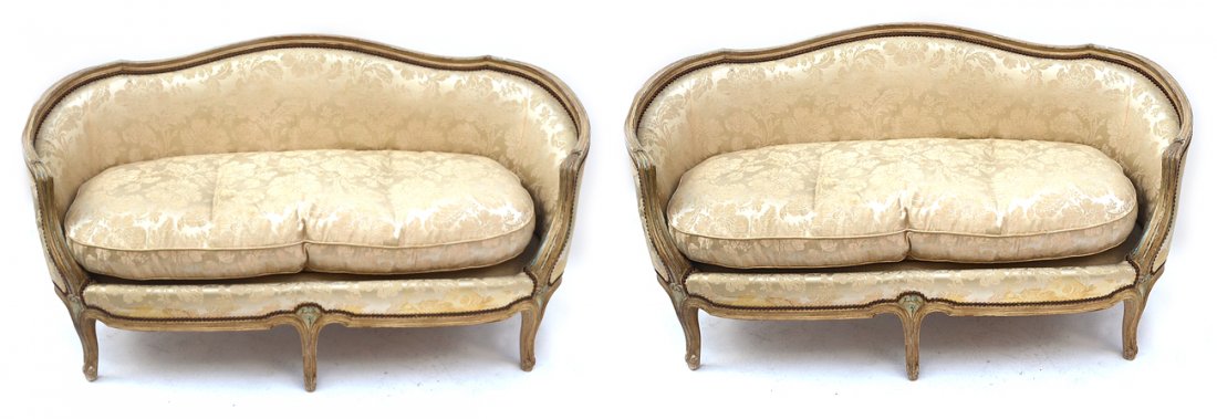Pair of Louis XV Style Settees: Pair of painted settees/canapes, floral creme upholstery. [58" W x 28" D x 32" H (back) x 20" H (to seat)]
