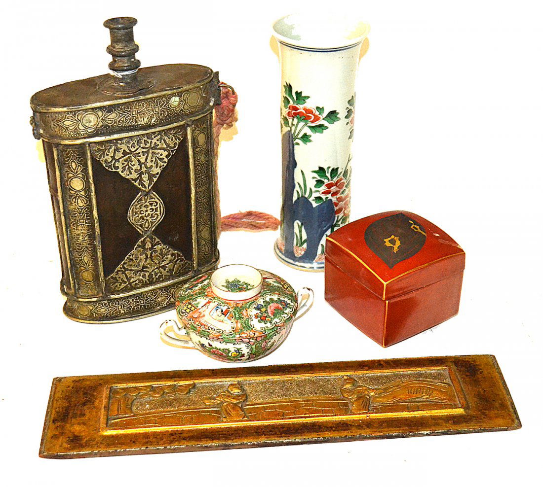 Five Assorted Asian Articles: Comprises 1) Metal decanter with repousse accents. [6 1/8" x 2 3/4" x 11" H]. 2) Cylindrical vase with floral decor. [3 1/2" x 9 3/8" H]. 3) Famille rose bullion cup and saucer. 4) Giltwood plaque wit