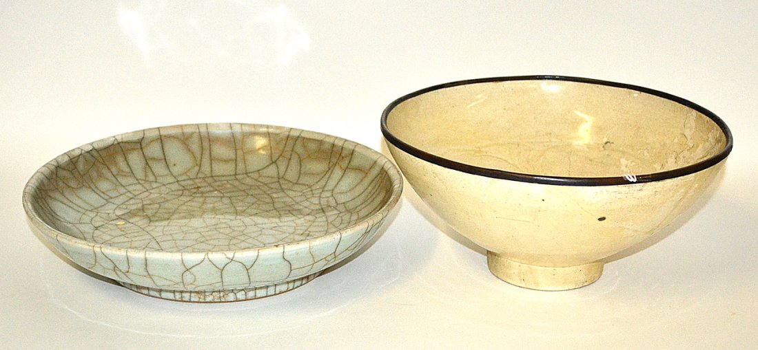 Antique Asian Crackle Glaze Bowl and Others: Shallow crackle celadon glazed earthenware bowl. [10 1/2" x 2 1/4" H]. Good condition. Accompanied by a repaired creme glazed bowl with incised interior decor. [9 1/2" x 4 1/4" H]. Sold as is.