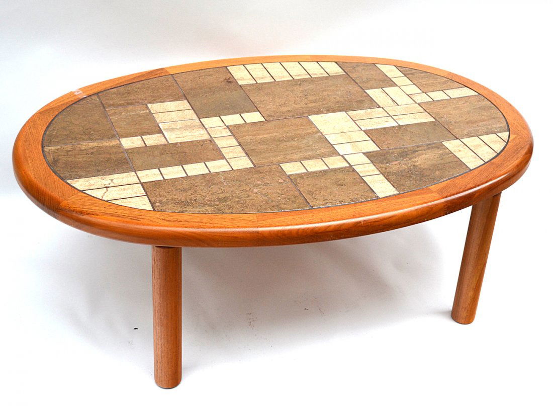 Haslev Danish Tile Top Low Table: Oval cocktail table with an inlay mineral tile top. Bears circular Haslev tag on bottom. [48 1/2" x 33" x 16 3/8"]. Good condition.