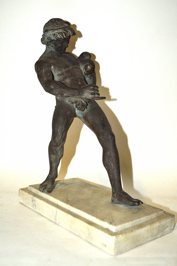 19th Century Tour Bronze Classical Figure: Standing full length depiction of Dionysis or Bacchus? figure bears a small tail at lower back and fig leaf at front. He is holding an animal form wine bladder into his other hand. [Element missing, l