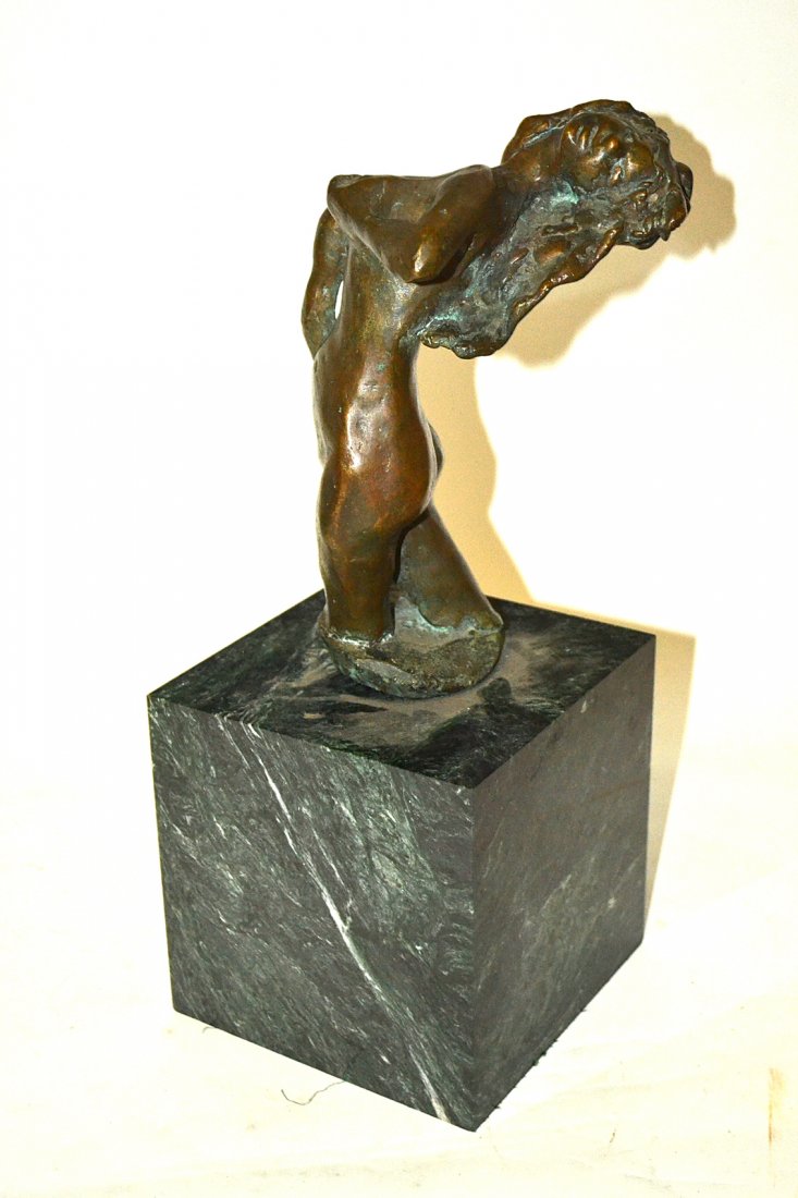 N. Kelly, Bronze - Female Nude: Modern sculpture depicting a woman standing in a 3/4 length pose holding her breasts with each hand. Signed at bottom: "N. Kelly" and dated underneath: "1962." Mounted on a green marble base. Bears br