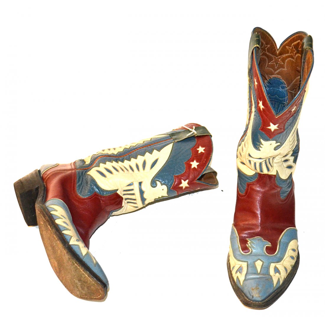 Nudie Cohn Cowboy Boots: Pair of vintage decorated cowboy boots designed by Nudie Cohn. Many were designed for the stars including Elvis Presley. Three pairs of his personally owned boots were sold to the Cowboy Hall of Fame.