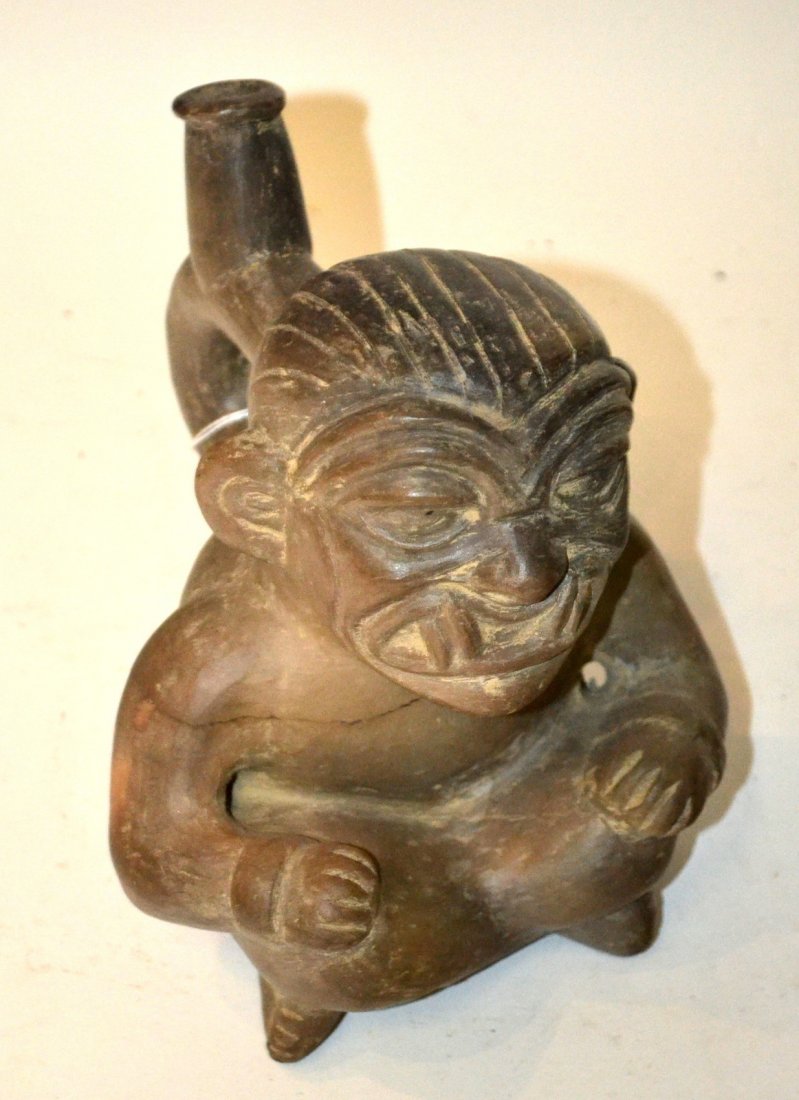 Five Mesoamerican Earthenware Objects: Comprises 1) Storage vessel [10" x 13" H]. 2) Standing reptilian creature 4 3/4" x 8 1/2" x 8 5/8" H]. 3) Creature with fins/wings. [4 3/4" x 7 5/8" x 2 1/8" H]. 4) Tripod footed vase with incised dec