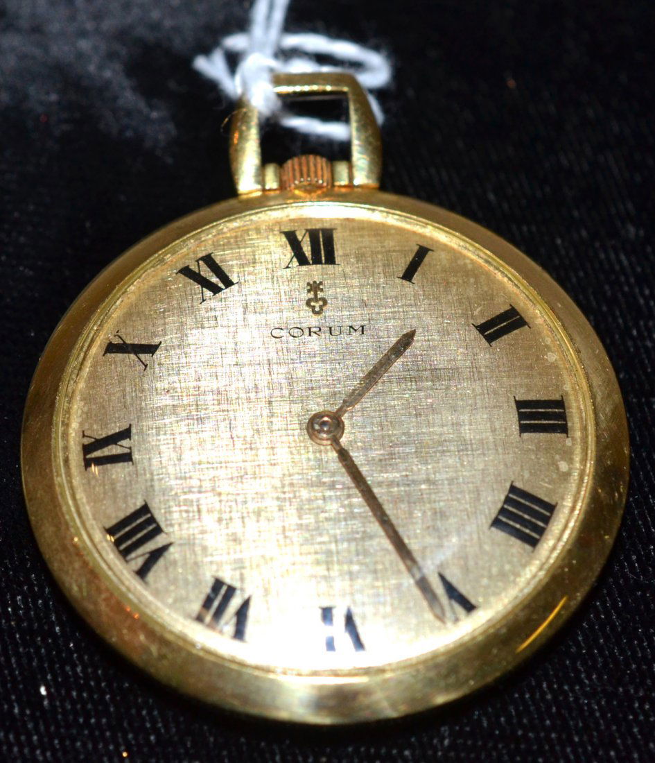 18k Gold Corum Enamel Pocket Watch: Swiss-made watch featuring enamel obverse being an allegorical scene depicting classical figures. [1 1/2" D overall]. 12.7 dwt. without movement. Not tested, sold as is, has rust.