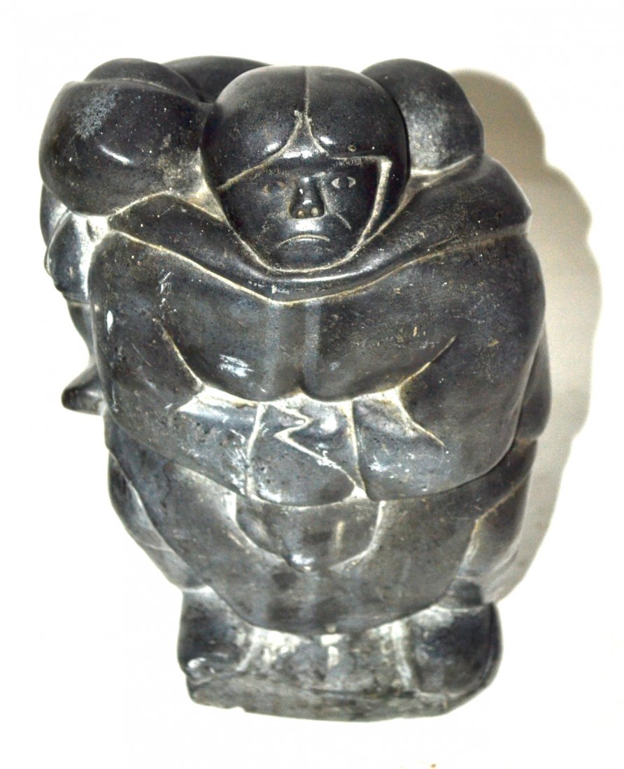 Inuit Soapstone Sculpture, Mother & Child: Stylized standing depiction of a mother with two small children on her back. 7" W x 6 1/2" D x 10 1/2" H. Unsigned. Scuffs and scratches.