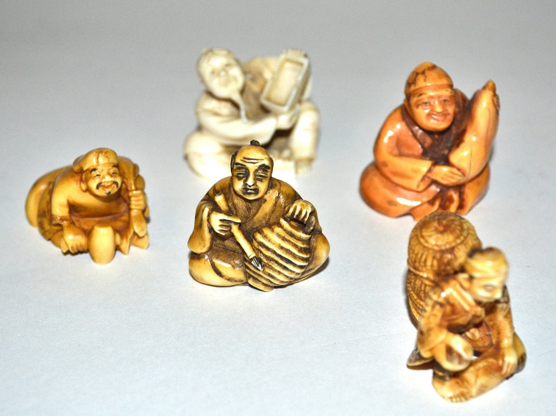 Vintage Netsukes, Merchants: Comprises 5 seated merchants with various wares. Tallest 1 3/4" H. Some bear calligraphic inscriptions on bottom.
