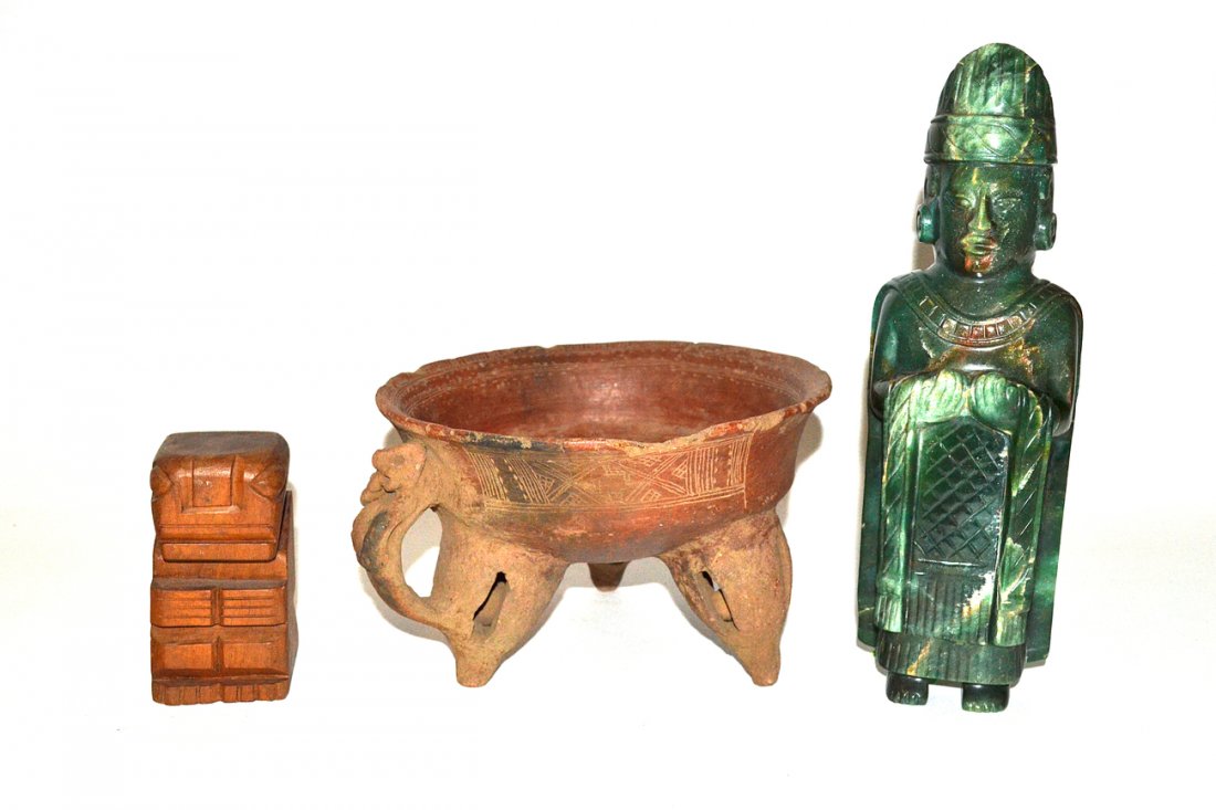 Mayan Style Carved Jade and Footed Bowl: Comprises a carved jade figure of a Mayan priest with ornate headdress. [3 5/8" W x 2 1/8" D x 11 3/8" H]. Accompanied by a tripod base earthenware bowl with hollow legs containing loose balls. [9 5/8