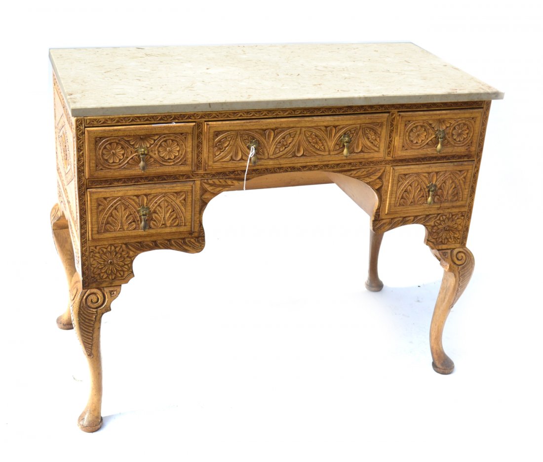 Belgian Carved Oak Vanity: Having five drawers with overall floral and foliate carving, and creme stone top. [40 1/2" x 19 5/8" x 32 1/4"].