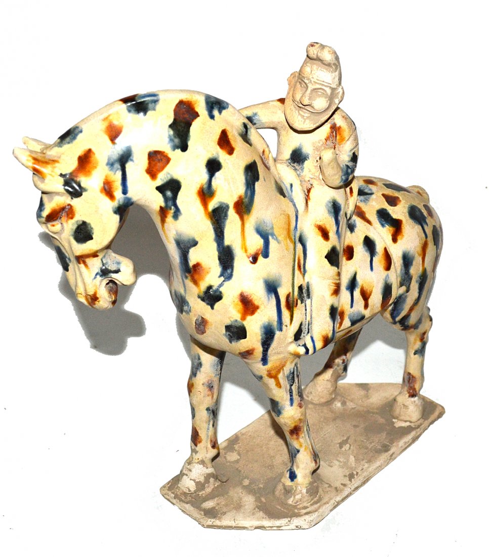 Asian Drip Glazed Equestrian Figure: Earthenware sculptures of a bearded rider atop a horse with blue and brown drip glazed decor. [10 1/2" W x 4 3/4" D x 11 1/8" H]. Wear and soiling.
