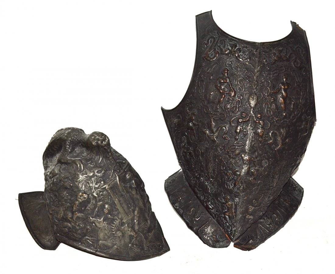 Two Pieces of Antique Armor: Comprises a breastplate and helmet, each with embossed mythological decoration. [Length of breastplate 21"].