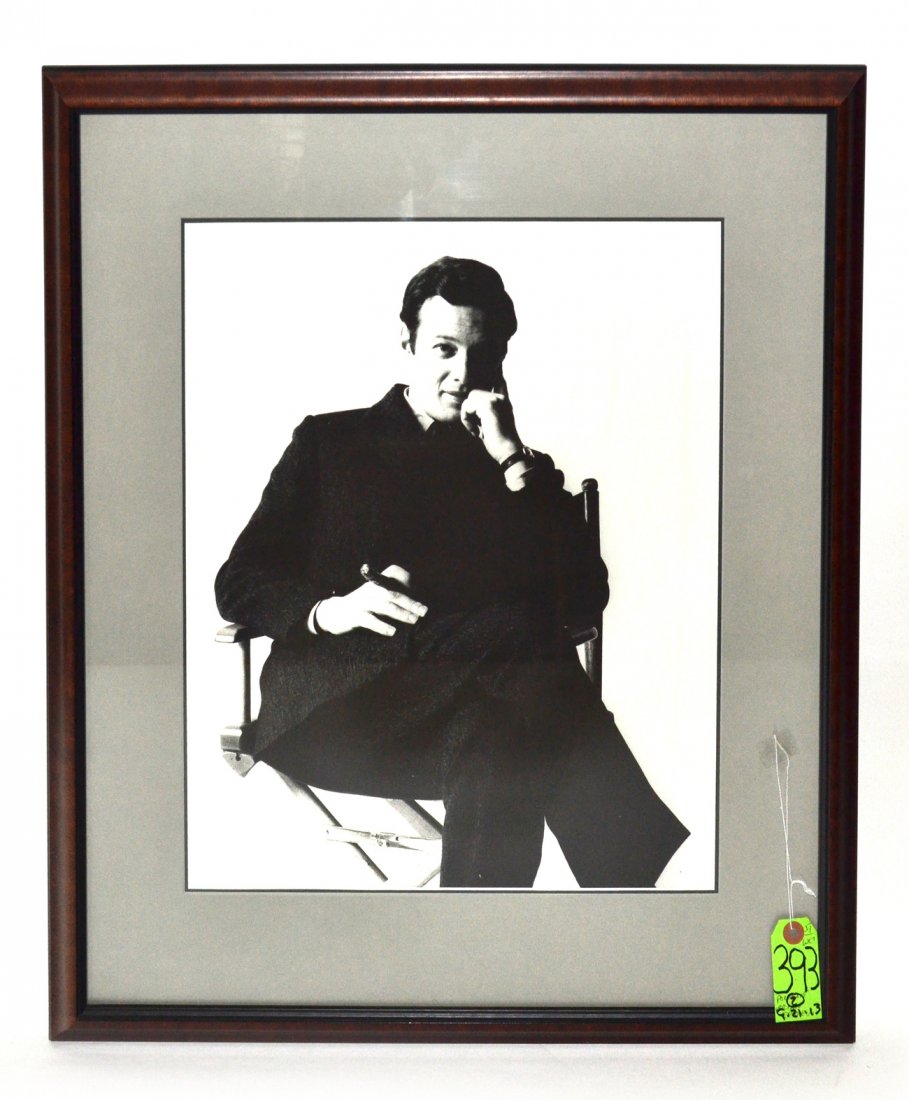 Photography: Brian Epstein: Large format black and white portrait of Beatles manager Brian Epstein depicted in a seated 3/4 length full profile pose, holding a cigar. Accompanied by original [10" x 8"] acetate negative. Photo ma