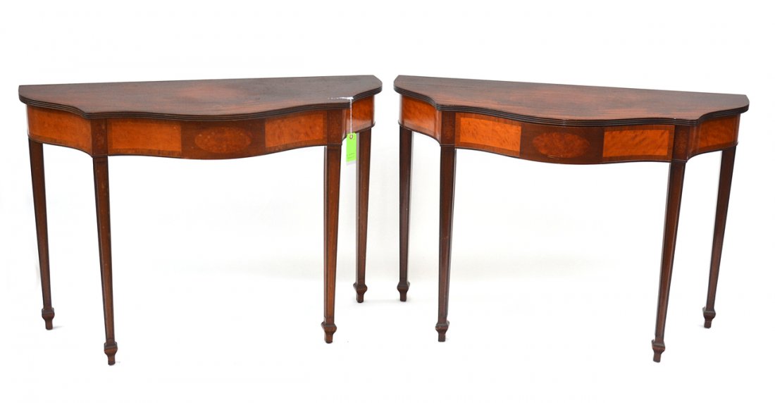 Pair of Schmeig and Kotzian Consoles: Hepplewhite style mahogany one-drawer consoles with apron drawer. [30" H x 42 1/2" W x 18" D].