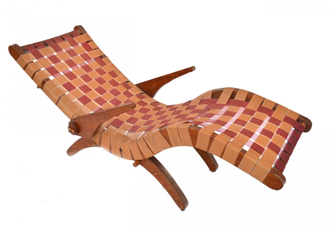 Mid-Century Modern Webbed Chaise: The curvilinear frame having adjustable arm rests and two tone webbing. American, circa 1950.