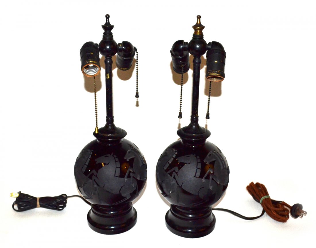 Pair of Art Deco Jarvil Glass Table Lamps: Pair of spherical black glass table lamps with intaglio and etched stallion motif. Both signed "Jarvil/Nancy". 5 3/4" D x 17" H to finial].