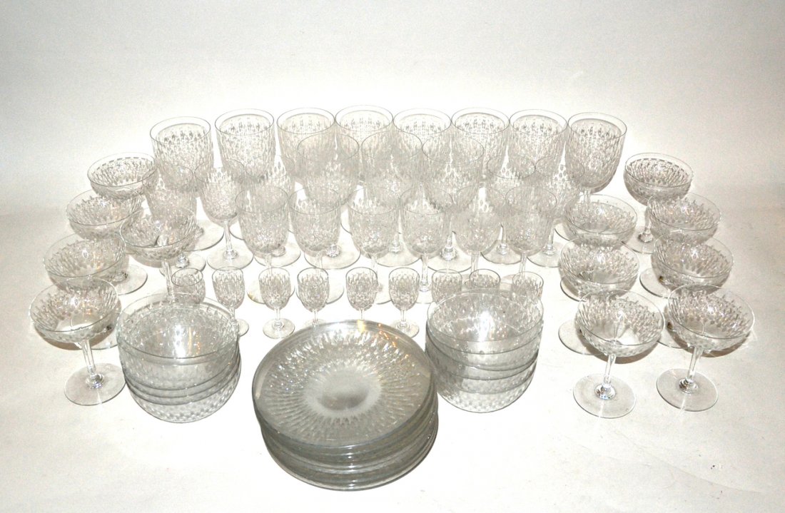 66 Piece Baccarat Stemware&Dessert Partial Service: Partial French crystal stemware and dessert service, Paris pattern established circa 1931. Comprises 12 champagne glasses, 11 goblets, 11 white wines, 9 cordials, 11 finger bowls, 10 underplates, 2 sa