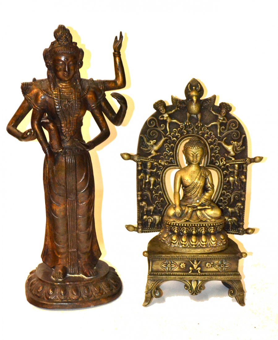 Two Buddhist Metal Sculptures: Comprises: 1). Seated Buddha on stand with ornate mandorla bearing various figures and fantastical creatures. [10" W x 4 1/2" D x 14 1/2" H]. 2). Standing full-length deity with six arms (one broken a