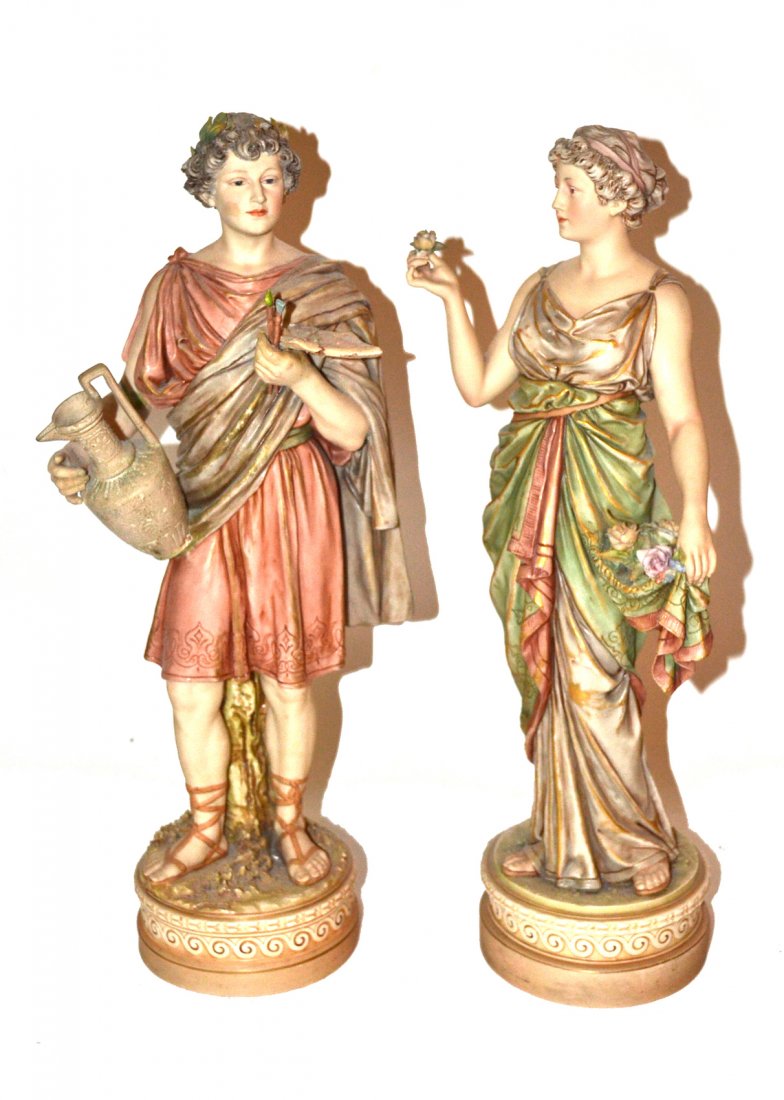 Pair of Royal Dux Figurines: Pair of figurines of a male and a female. One with artist's palette, the other with a flower.