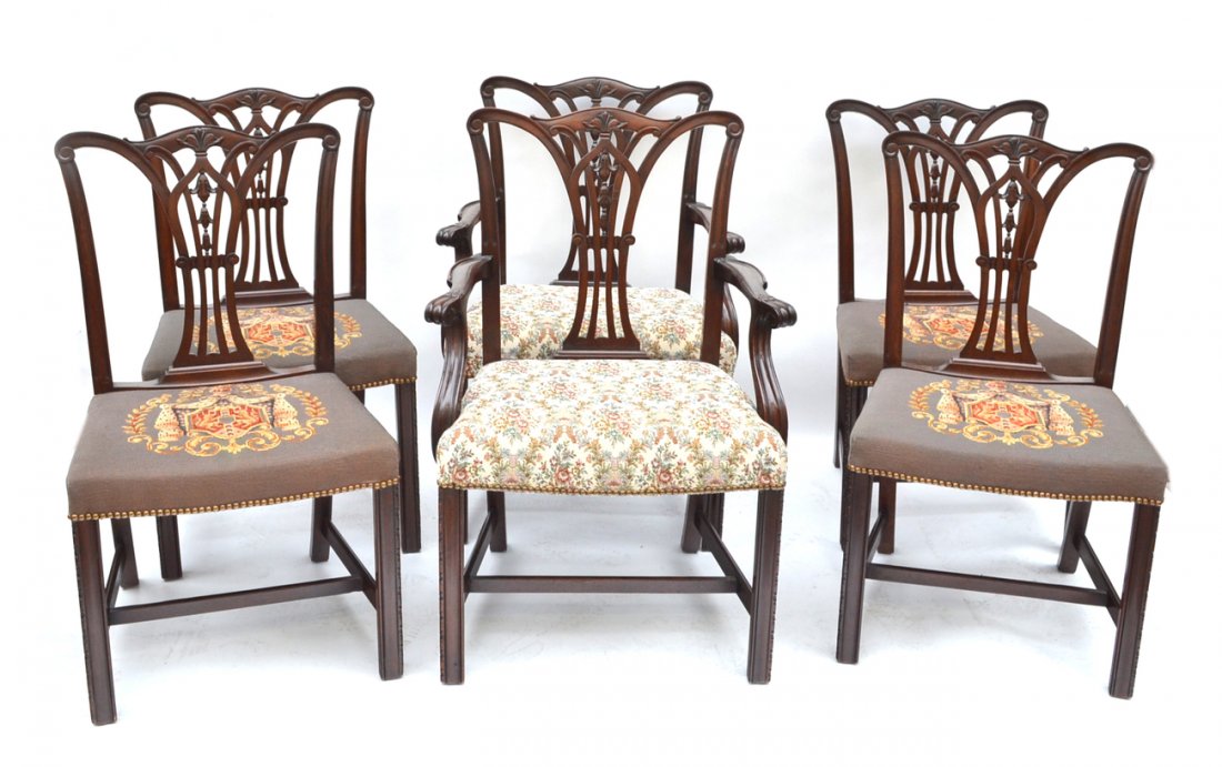 6 Dining Chairs: Set of six Georgian-style dining chairs, open backs, four with armorial design needlepoint seats, the other with floral needlepoint seats. 2 armchairs, 4 side chairs. In good condition.