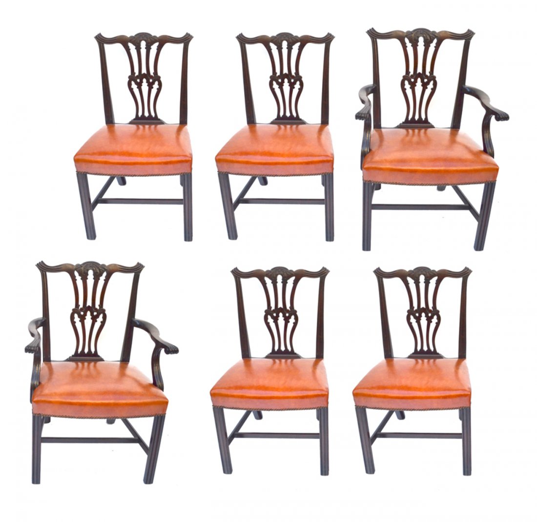 Set of Eight Georgian Style Dining Chairs: Comprises a mahogany set of 2 armchairs and 6 side chairs. All bear pierced carved back splats, straight fluted front legs and saddle seats. [21 1/2" w x 21" d x 37" h (19 3/4" high to seat)]. Wear co