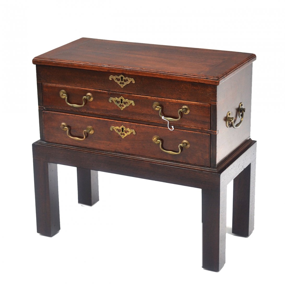 Antique English Mahogany Tool Chest on Stand: Bears hinged top with interior compartments above two drawer featuring bale-handle pulls and pierced escutcheons. [21" w x 10 1/2" d x 9 7/8" h on stand]. Good condition. Provenance: Ginsburg & Levy.