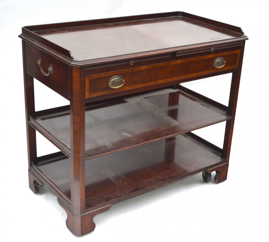 Mahogany Server: Georgian style mahogany one drawer (compartment design) server, two open shelves and two tooled leather. The top pull out slides on casters. Manufactured by Old Colony Furniture Company. [36" x 20 1/4