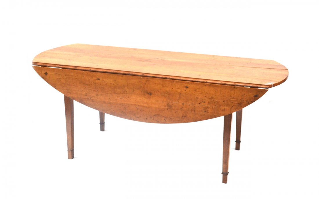 Antique French Drop-Leaf Dining Table: 19th century with polished rusticated surface. [Open 72" w x 52" deep oval. Closed 72" w x 26" deep].