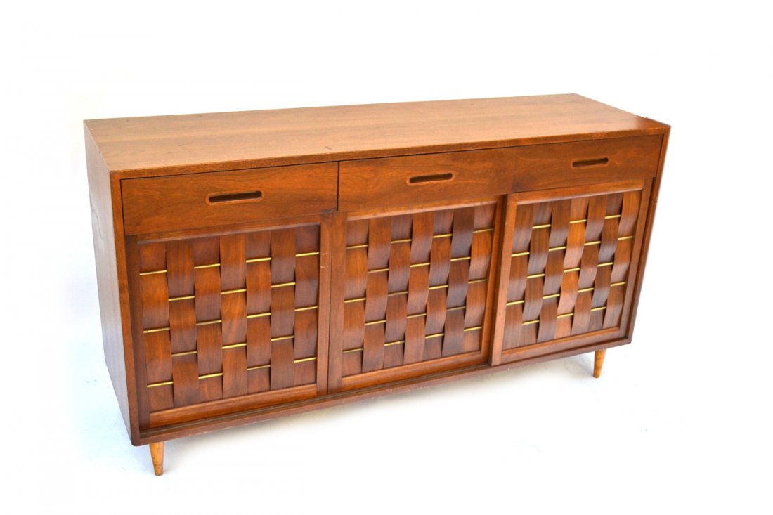 Modern Dunbar Mahogany Sideboard: Features three drawers above three sliding panel doors with woven black walnut strips and brass accents. Interior bears three drawers at either side. [61 1/2" x 18" x 34" h]. Scuffs and scratches.
