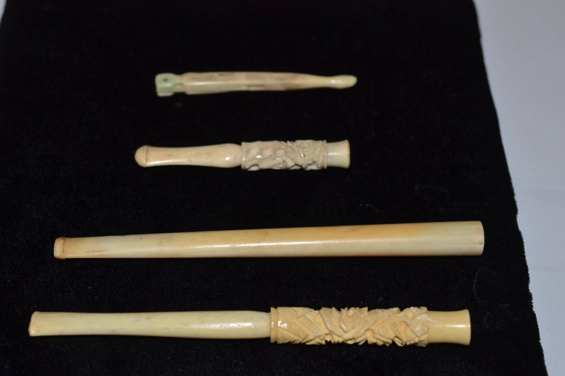 Vintage Carved Ivory Cigarette Holders: Comprises 1) Cigarette holder with leafy flower carved barrel [5 1/2" long] 2) Short cigarette holder with dragon carved barrel [3" long] 3) Long cigarette holder with smooth barrel [5 5/8" long]. Acc