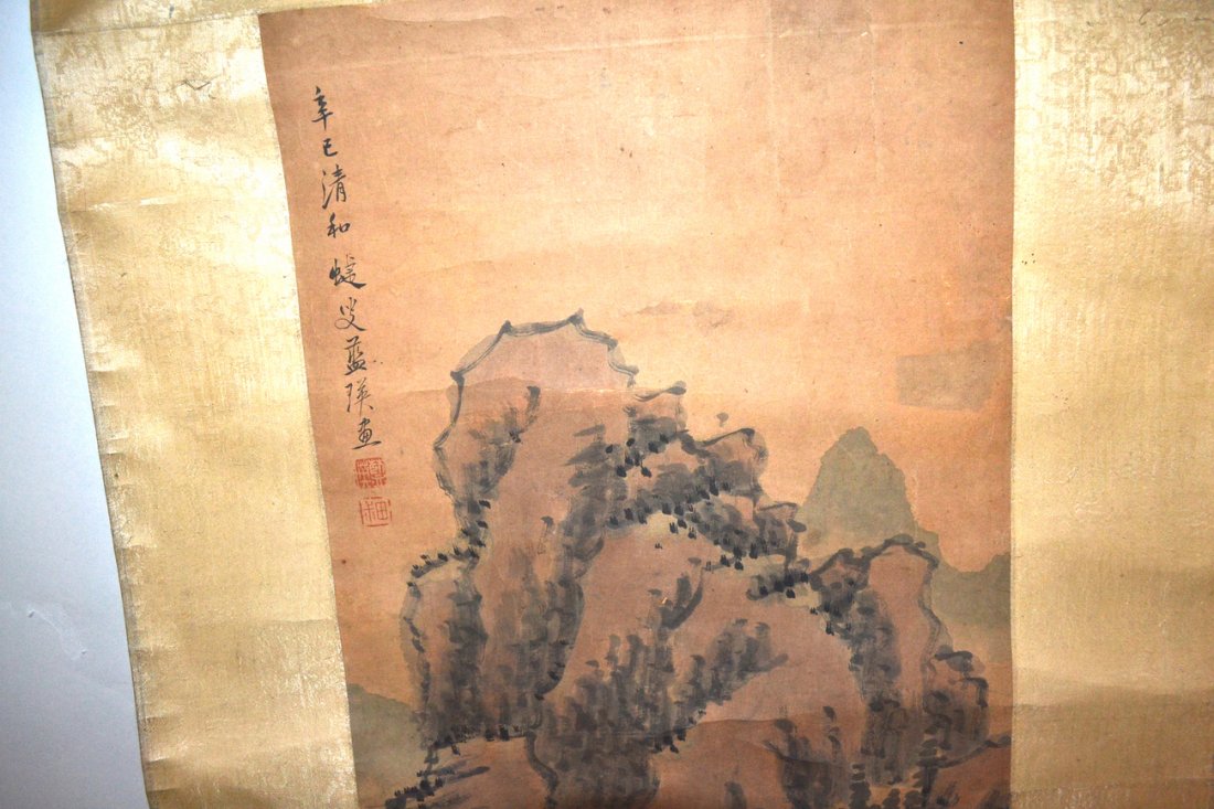 Three Vintage Asian Scrolls: Comprises: 1) Japanese watercolor depicting fruit bunches. Bears blue and white ceramic scroll ends, 2) reproduction of green mountains with village below. Bears turned wood scroll ends, 3) reproducti