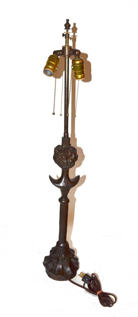 Reproduction alberto Giacometti Bronze Lamp: Sculptural table lamp featuring a female bust on a cylindrical shaft with two-tier base. Inscribed on base 'Alberto Giacometti'. 5 1/4" w x 5 1/8" d x 32 1/2" h. Bears a dark brown patina.