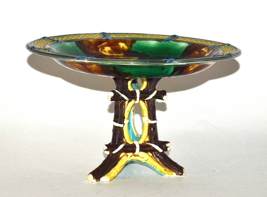 Antique Majolica Tazza: Having a faux bamboo base supporting a mottled glaze plate with molded basket weave decor. [5 1/2" H x 9 1/8" D].