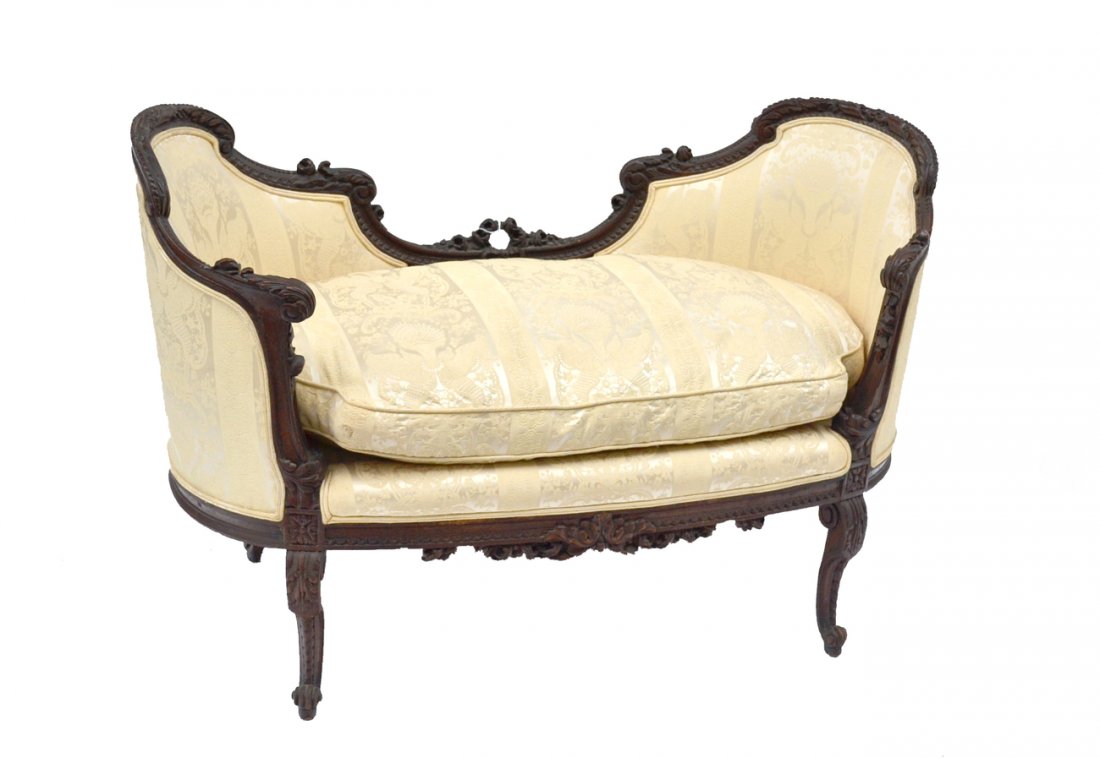 French Carved Settee: Louis XV style carved wood settee with classical creme upholstery. [40" x 23" x 30 1/2" h].