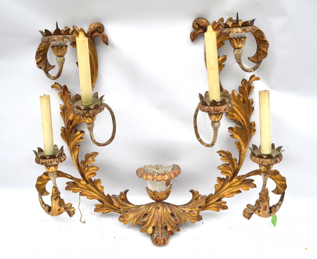 Large Italian Carved and Giltwood Sconce: Bears six iron arms clad in carved and giltwood scrolling leafy elements and arrange in three tiers. Bears a lined planter at bottom center. [41 1/4" w x 8 1/2" d x 33 1/2" h]. Some chips with losses,