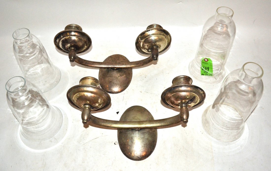 Pair of Silver Plate Sconces: Pair of silver plate sconces with four glass hurricane shades. [2" x 7 1/4" and 2" x 8 1/4"; 12 1/2" w x 6 1/4" d x 5 3/4" h].