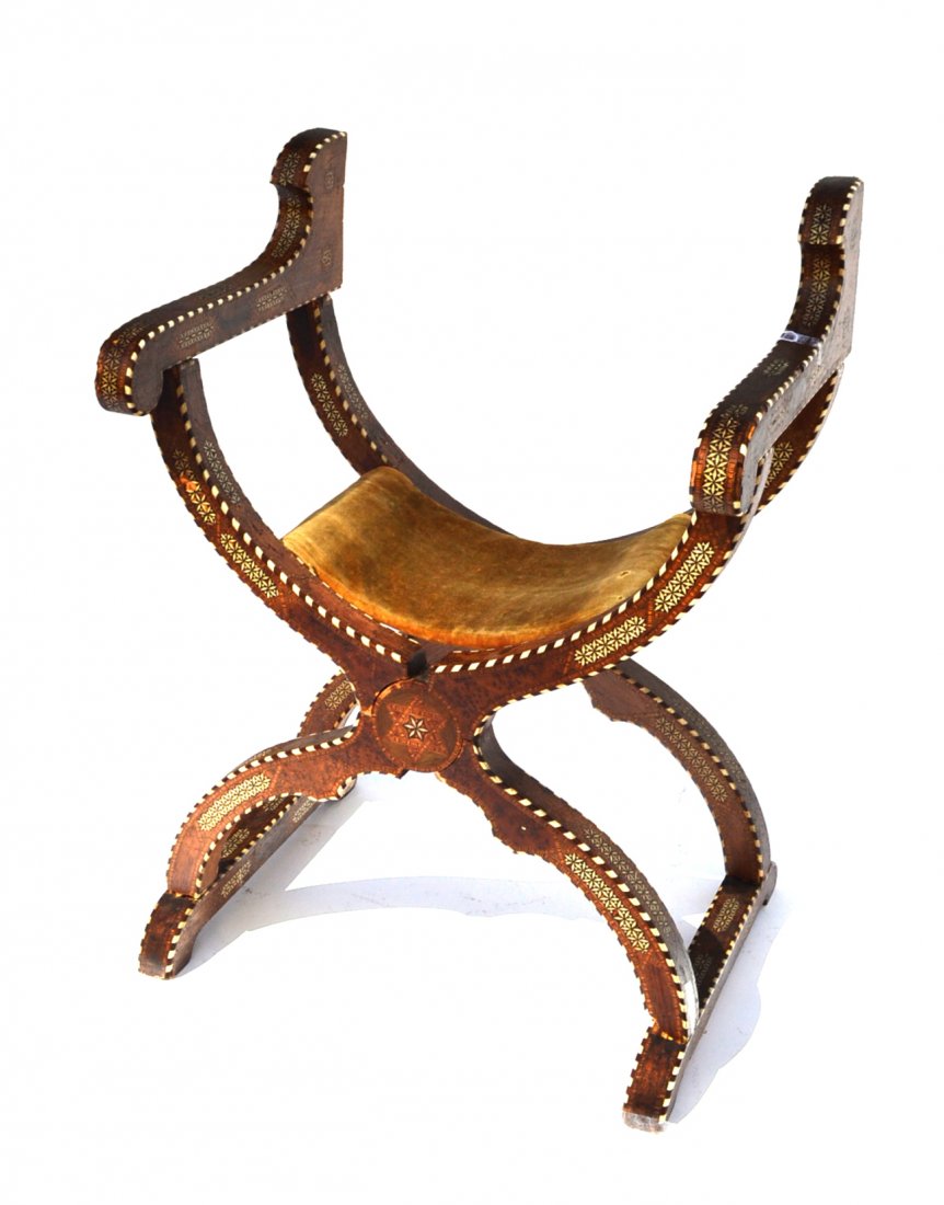 Antique Moroccan Inlaid "Throne" Chair: X-form open armchair with all over geometric parquetry, ivory and bone inlay. [25 1/4" w x 18 1/4" d x 34 1/2" h]. Wear consistent with age and use.