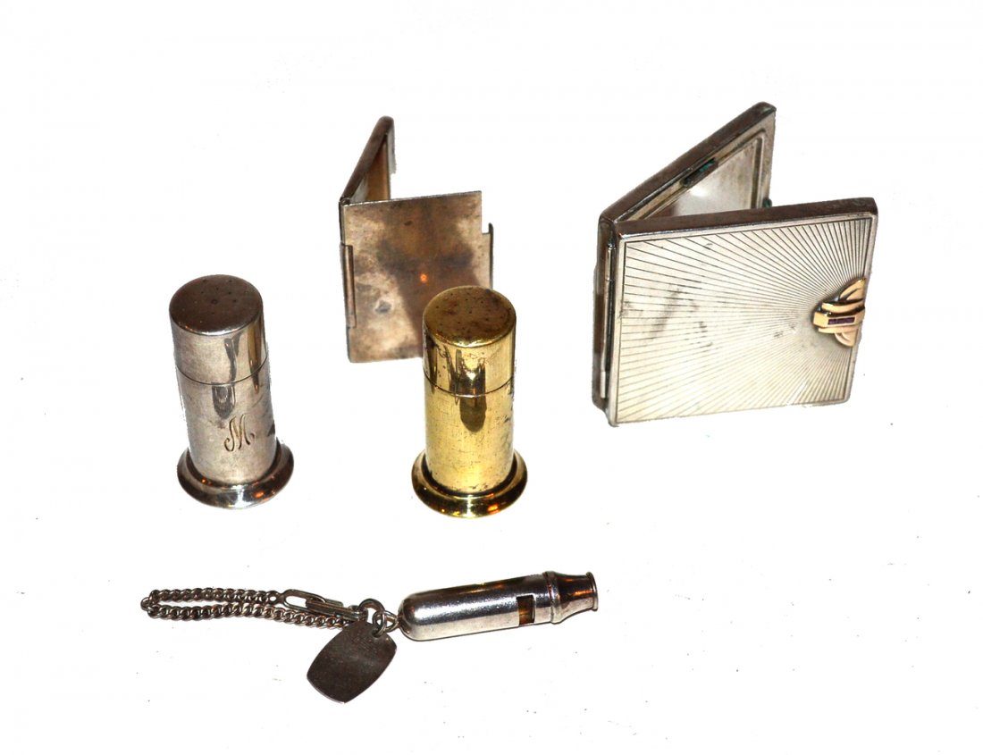 Tiffany & Co. Sterling Silver Accessories: Comprises 1) Compact with 14k gold accent bearing three baguette rubies. Interior mirror discolored. [2 3/8" square x 3/8" h]. 2) Two standing match safes. Each stamped "Tiffany & Co. Makers". [Both 2