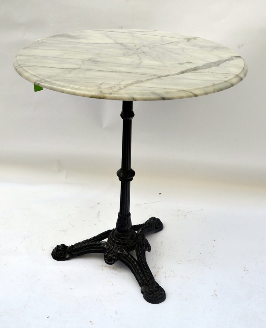 Marble and Iron Bistro Table: Bistro table with black iron base and white beveled marble top. [29" h x 25 1/2" dia].