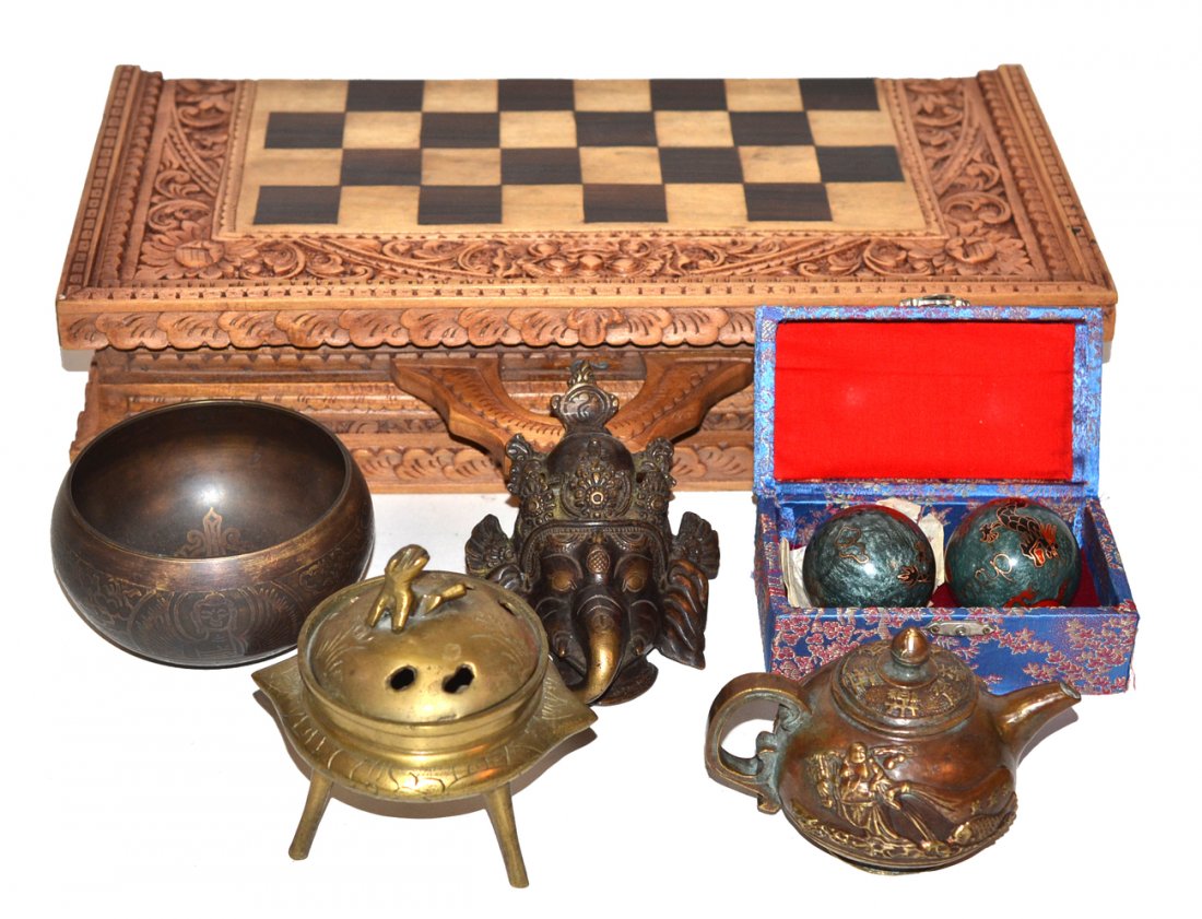 Assorted Far Eastern Articles: Comprises: 1). Pair of Chinese cloisonné "gong" balls. 2). Indonesian chess set. 3). Diminutive Buddhist bronze tea pot. 4). Chinese brass incensor. 5). Indian bronze elephant deity head. 6). Buddhis