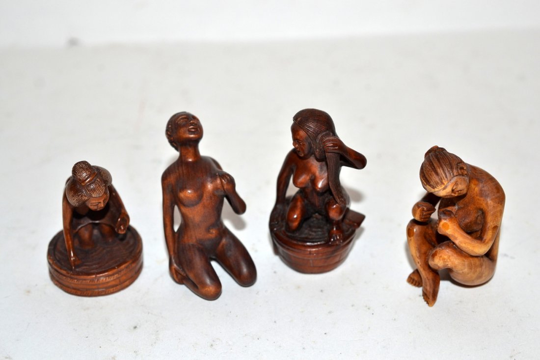 Four Wood Women: Four Netsuke style nude women.