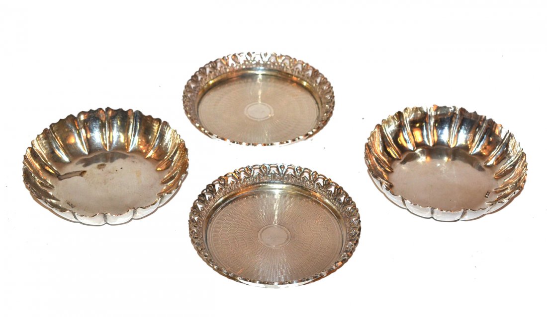 Four Egyptian Silver Articles: Comprises a pair of fitted dishes, along with a pair of engine turned coasters. In good condition. 11.07 ozt.