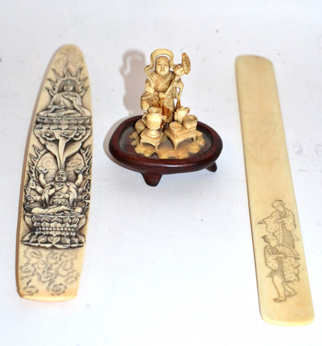 Three Antique Carved Ivory Articles: Includes letter opener and two carvings. All in good condition. [Largest: 9 ½" long].