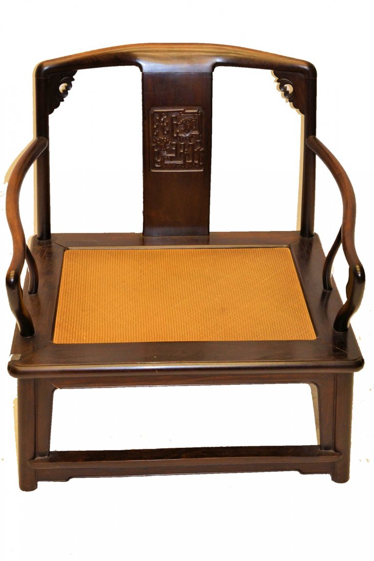 Chinese Rosewood Armchair: Caned seat. In good condition. [30 1/2" h (13" h to seat) x 28" w x 22 1/2"d]. From the Estate of Paul Szilard.